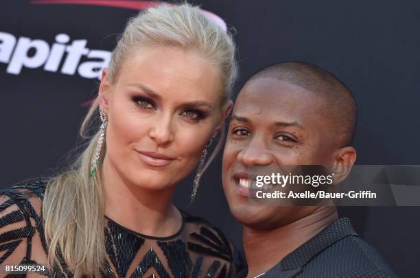 Olympic skier Lindsey Vonn and former NFL coach Kenan Smith arrive at the 2017 ESPYS at Microsoft Theater on July 12, 2017 in Los Angeles, California.