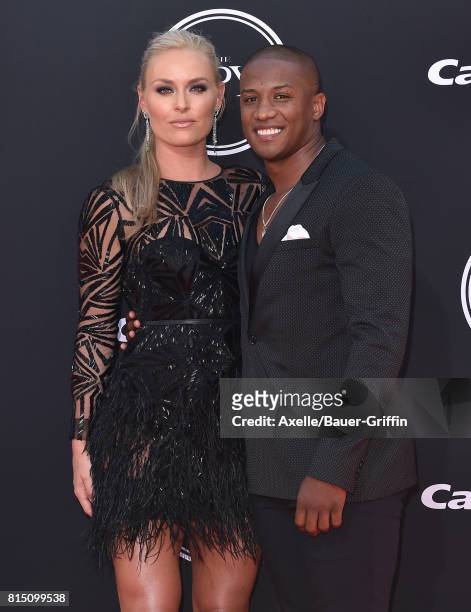 Olympic skier Lindsey Vonn and former NFL coach Kenan Smith arrive at the 2017 ESPYS at Microsoft Theater on July 12, 2017 in Los Angeles, California.