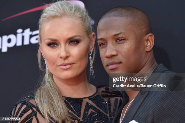 Olympic skier Lindsey Vonn and former NFL coach Kenan Smith arrive at the 2017 ESPYS at Microsoft Theater on July 12, 2017 in Los Angeles, California.