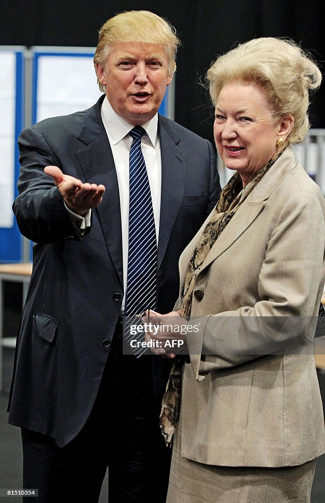 US property tycoon Donald Trump (L) is p