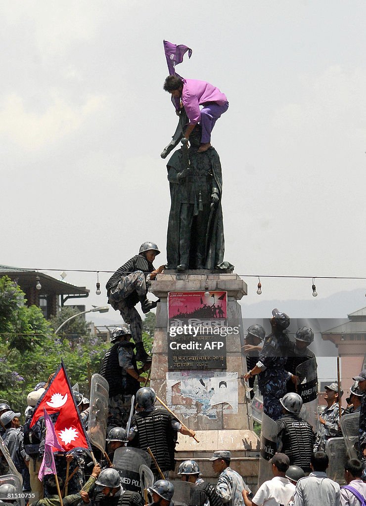 Nepali anti riot police try to detain ma