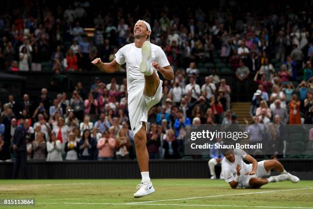 Lukasz Kubot of Poland dances in celebration as Marcelo Melo of Brazil looks on after victory in the Gentlemen's Doubles final against Oliver Marach...