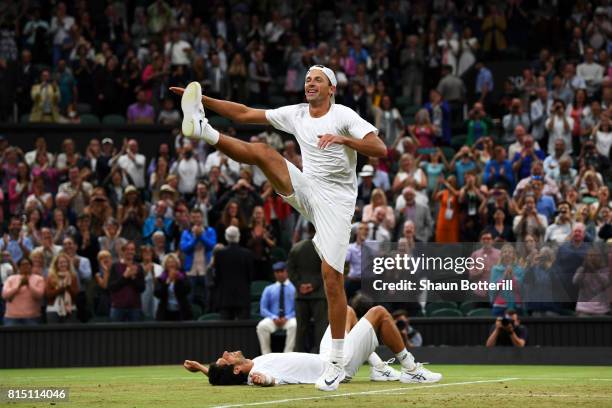 Lukasz Kubot of Poland dances in celebration as Marcelo Melo of Brazil looks on after victory in the Gentlemen's Doubles final against Oliver Marach...