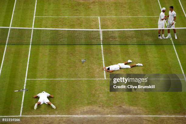 Marcelo Melo of Brazil and Lukasz Kubot of Poland celebrate championship point and victory during the Gentlemen's Doubles final against Oliver Marach...