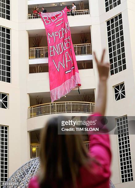 Security guards remove a Code Pink banner as Republican presidential candidate US Sen. John McCain speaks during the 2008 National Small Business...
