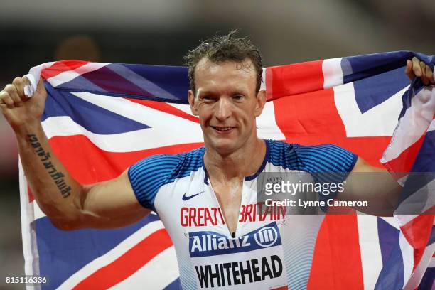 Richard Whitehead of Great Britain celebrates winning the gold medal in the Men's 200m T42 Final during Day Two of the IPC World ParaAthletics...