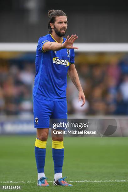 George Francomb of Wimbledon in action during the pre-season friendly match between AFC Wimbledon and Watford at The Cherry Red Records Stadium on...