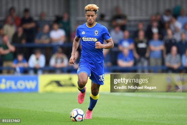 Lyle Taylor of Wimbledon in action during the pre-season friendly match between AFC Wimbledon and Watford at The Cherry Red Records Stadium on July...