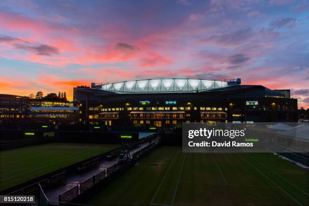 General view of the Centre Court as the sun sets on day twelve of the Wimbledon Lawn Tennis Championships at the All England Lawn Tennis and Croquet...