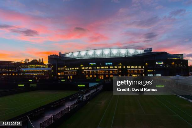 General view of the Centre Court as the sun sets on day twelve of the Wimbledon Lawn Tennis Championships at the All England Lawn Tennis and Croquet...