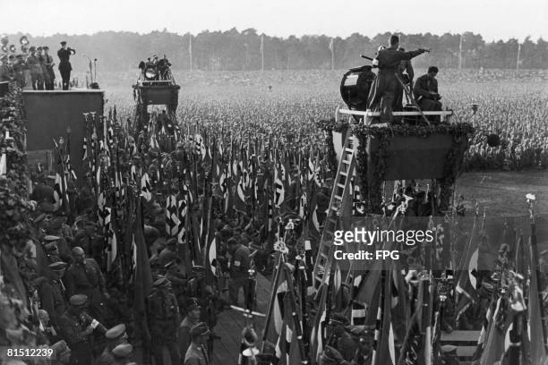 Cameramen and lighting rigs at the Nuremberg Rally to mark the 6th Nazi Party Congress, September 1934. The event was filmed by Leni Riefenstahl and...