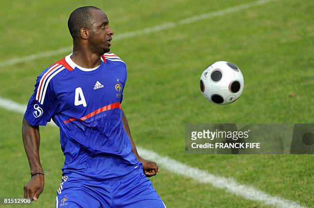 French national football team captain Patrick Vieira controls the ball during a friendly football match against the U-18 team from Fribourg and...