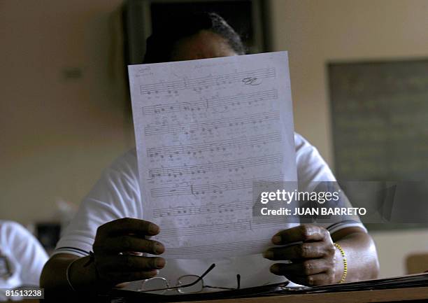 An inmate of the women's prison Instituto Nacional de Orientacion Femenina attends singing lessons on June 10, 2008 inside the prison in the locality...