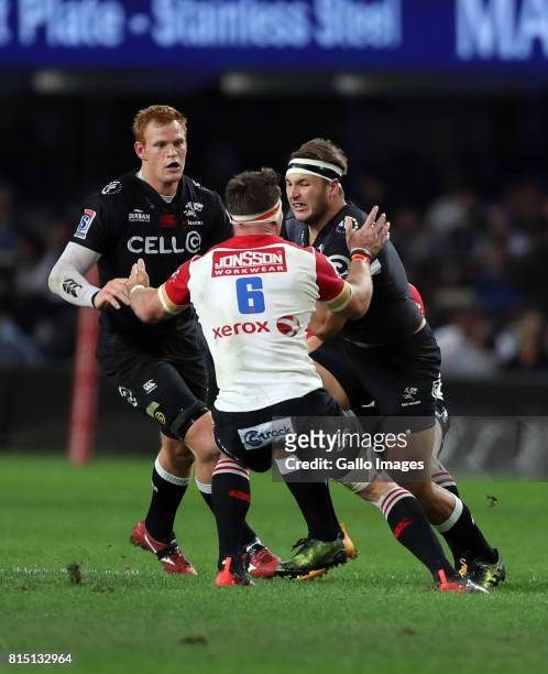 Jaco Kriel of the Emirates Lions looks to stop Andre Esterhuizen of the Cell C Sharks during the Super Rugby match between Cell C Sharks and Emirates...