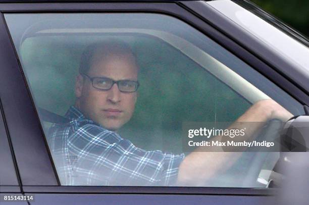 Prince William, Duke of Cambridge arrives, driving his Range Rover car, to play in the Jerudong Park Trophy charity polo match at Cirencester Park...