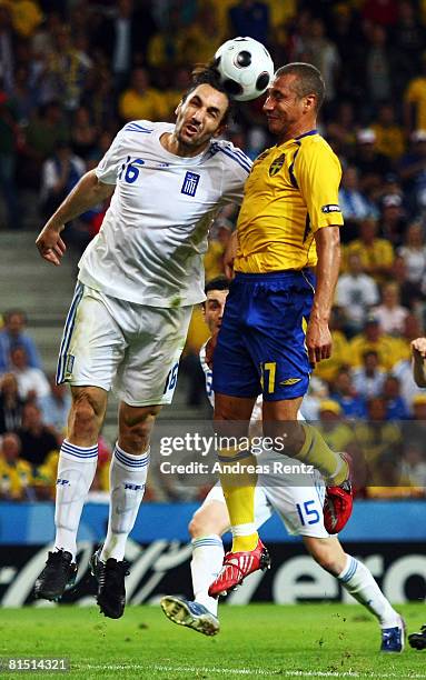 Henrik Larsson of Sweden jumps for a header with Sotirios Kyrgiakos of Greece during the UEFA EURO 2008 Group D match between Greece and Sweden at...