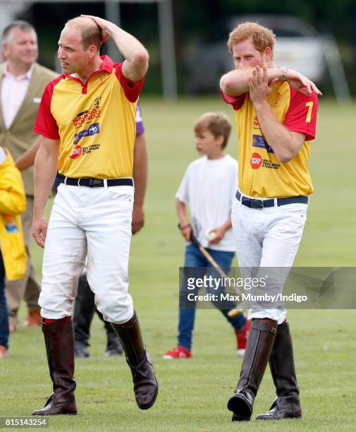 Prince William, Duke of Cambridge and Prince Harry attend the presentation after playing in the Jerudong Park Trophy charity polo match at...