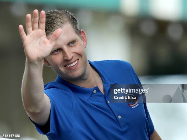 Eric Trump waves as he heads into U.S. President Donald Trump's suite during the U.S. Women's Open round three on July 15, 2017 at Trump National...