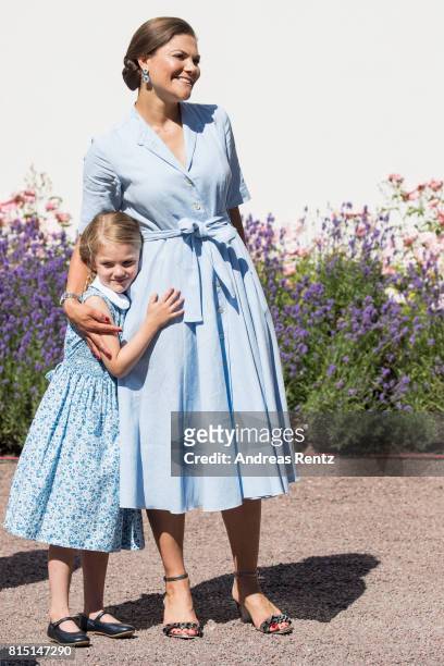 Crown Princess Victoria of Sweden and Princess Estelle of Sweden are seen meeting the people gathered in front of Solliden Palace to celebrate the...