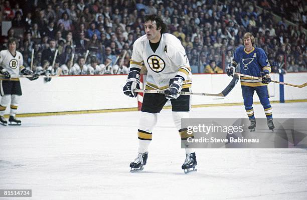 Phil Esposito of the Boston Bruins skates in game against the St. Louis Blues at the Boston Garden .