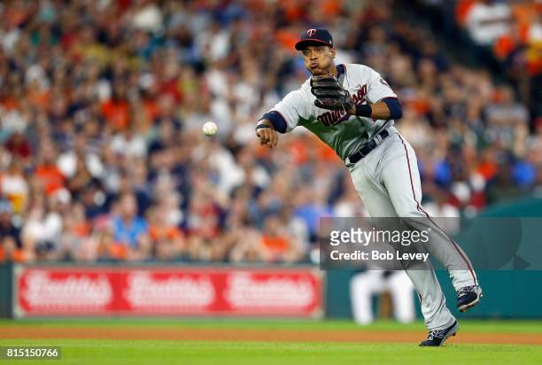 Jorge Polanco of the Minnesota Twins throws to first base to retire Evan Gattis of the Houston Astros in the fourth inning at Minute Maid Park on...
