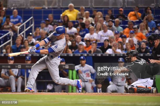 Cody Bellinger of the Los Angeles Dodgers hits a home run in the third inning against the Miami Marlins at Marlins Park on July 15, 2017 in Miami,...