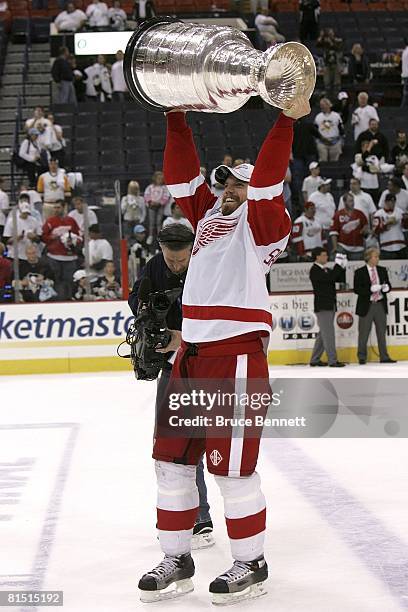 Mikael Samuelsson of the Detroit Red Wings celebrates with the Stanley Cup after defeating the Pittsburgh Penguins in game six of the 2008 NHL...