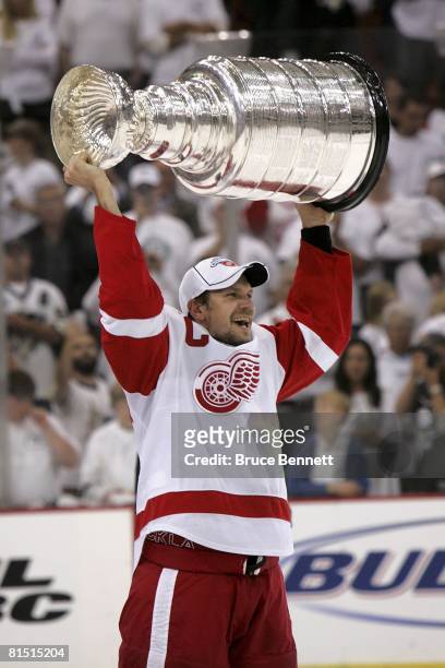 Nicklas Lidstrom of the Detroit Red Wings celebrates with the Stanley Cup after defeating the Pittsburgh Penguins in game six of the 2008 NHL Stanley...