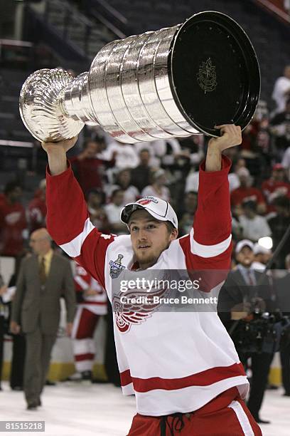 Darren Helm of the Detroit Red Wings celebrates with the Stanley Cup after defeating the Pittsburgh Penguins in game six of the 2008 NHL Stanley Cup...