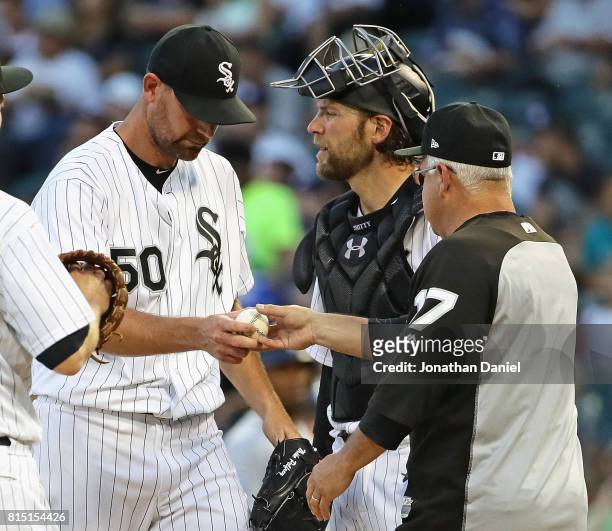 Starting pitcher Mike Pelfrey of the Chicago White Sox is taken out of the game against the Seattle Mariners in the 5th inning by manager Rick...