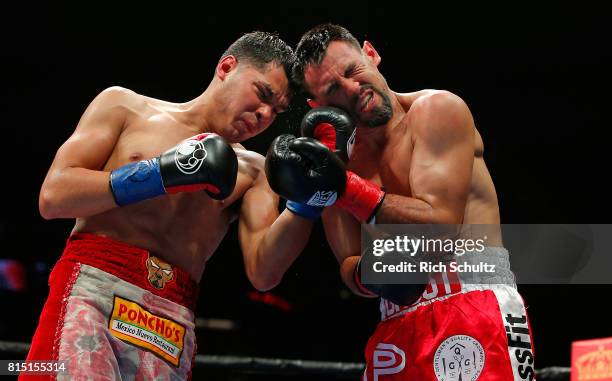 Omar Figueroa Jr., left, connects with a left punch to the face of Robert Guerrero during their Welterweight fight at Nassau Veterans Memorial...