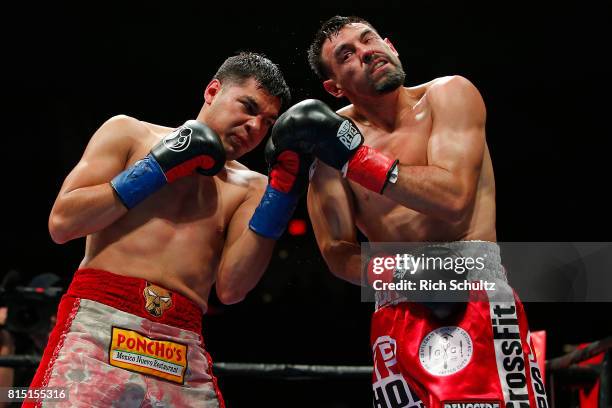 Omar Figueroa Jr., left, battles Robert Guerrero during their Welterweight fight at Nassau Veterans Memorial Coliseum on July 15, 2017 in Uniondale,...