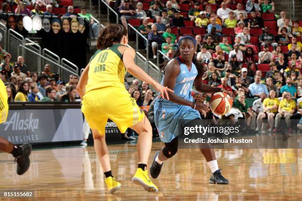 Matee Ajavon of the Atlanta Dream handles the ball during the game against the Seattle Storm during a WNBA game on July 15, 2017 at Key Arena in...