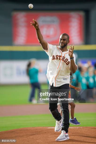 Houston Rockets Chris Paul throws the first pitch before the MLB game between the Minnesota Twins and Houston Astros on July 14, 2017 at Minute Maid...
