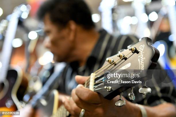 Legendary Recording Artist Charley Pride visits a booth during Summer NAMM Show Music Industry Day at Music City Center on July 13, 2017 in...