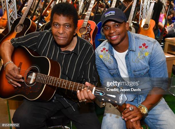 Recording Artist Charley Pride speaks with Recording Artist Jimmie Allen during Summer NAMM Show Music Industry Day at Music City Center on July 15,...
