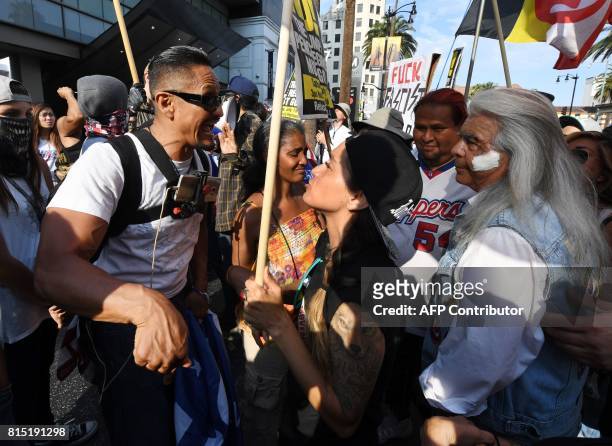 People argue as supporters of US President Donald Trump try to disrupt an anti-Trump protest organized by Refuse Fascism L.A. At the site of Trump's...