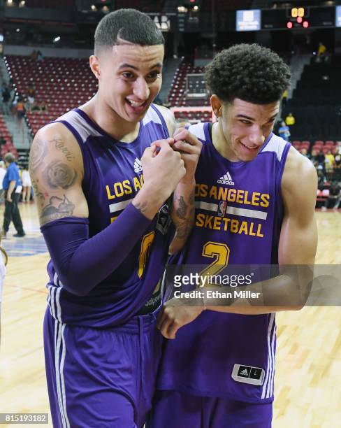 Kyle Kuzma and Lonzo Ball of the Los Angeles Lakers walk off the court after the team's 115-106 win over the Brooklyn Nets during the 2017 Summer...