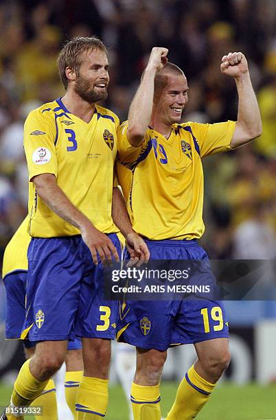 Swedish midfielder Daniel Andersson and Swedish defender Olof Mellberg celebrate at the end of their Euro 2008 Championships Group D football match...