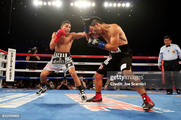 Miguel Berchelt throws a punch to Takashi Miura in the first round of the WBC Super Featherweight Title Fight at The Forum on July 15, 2017 in...