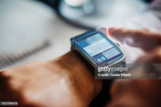 businesswoman using smartwatch. - wearable computer bildbanksfoton och bilder