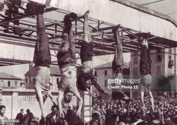 Benito Mussolini and his mistress Clara Petacci hanging in a public square after their execution by Italian Communist partisans in April 1945.