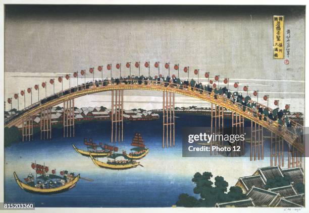 The Temma Bridge at Osaka', c1830. Coloured woodblock print. People crowd on the wooden bridge which is decked with coloured paper lanterns, and look...