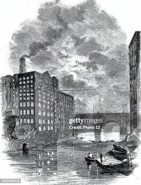 Blackfriars Bridge and a view of cotton mills from the river Irwell showing the mill windows lit up as a night shift was at work. Engraving c1850.