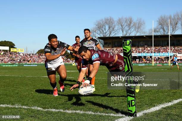 Matthew Wright of the Sea Eagles scores a try during the round 19 NRL match between the Manly Sea Eagles and the Wests Tigers at Lottoland on July...