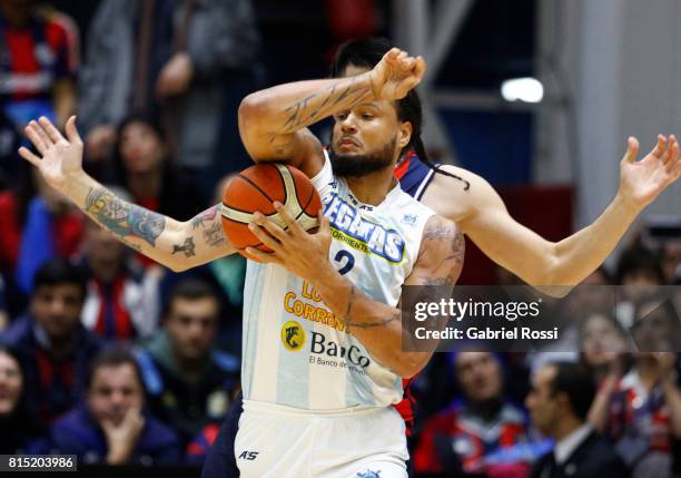 Gabriel Deck of San Lorenzo fights for the ball with Chevon Troutman of Regatas during the fifth game between San Lorenzo and Regatas as part of LNB...