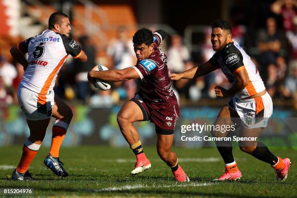 Brian Kelly of the Sea Eagles runs the ball during the round 19 NRL match between the Manly Sea Eagles and the Wests Tigers at Lottoland on July 16,...