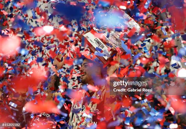 Nicolas Aguirre of San Lorenzo lifts the trophy to celebrate after winning the fifth game between San Lorenzo and Regatas as part of LNB 2017 Finals...