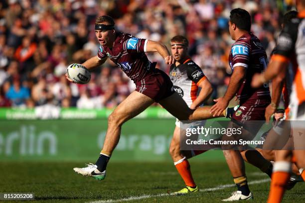 Tom Trbojevic of the Sea Eagles makes a break the round 19 NRL match between the Manly Sea Eagles and the Wests Tigers at Lottoland on July 16, 2017...