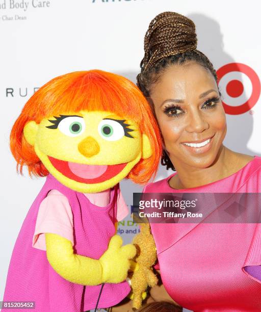 Host Holly Robinson Peete and the first autistic Sesame Street character, Julia, at HollyRod Foundation's DesignCare Gala on July 15, 2017 in Pacific...